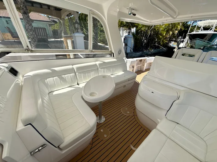  Yacht Photos Pics Luxurious 2013 Intrepid 390 Sport Yacht interior with white seating and wooden flooring.