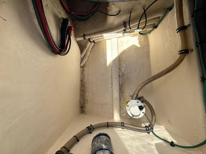  Yacht Photos Pics Bilge area of a 2013 Intrepid 390 Sport Yacht with visible wiring and hoses.