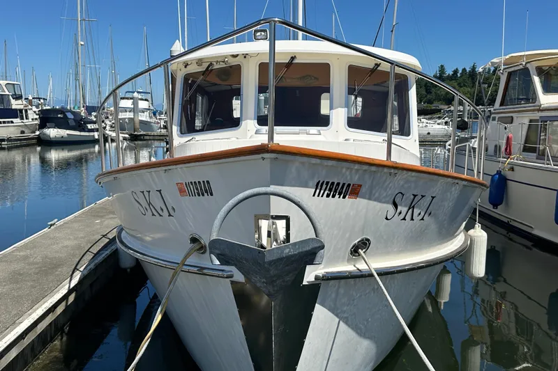S.k.i Yacht Photos Pics 2000 Eagle 40 Pilothouse Trawler docked in a marina, surrounded by other boats.