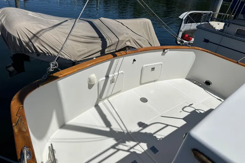 S.k.i Yacht Photos Pics Cockpit of 2000 Eagle 40 Pilothouse Trawler with wooden trim and covered equipment.