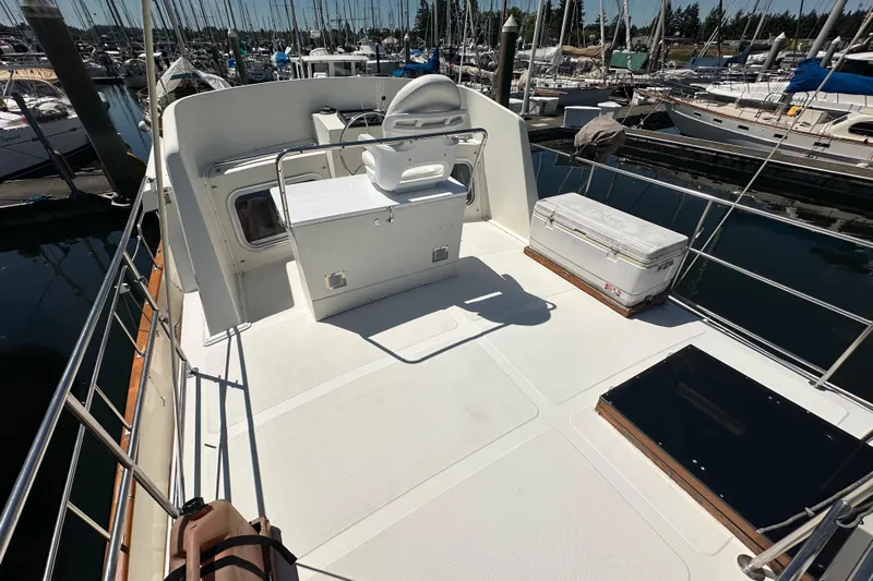 S.k.i Yacht Photos Pics Eagle 40 Pilothouse Trawler 2000 model, spacious deck with seating, docked at marina.