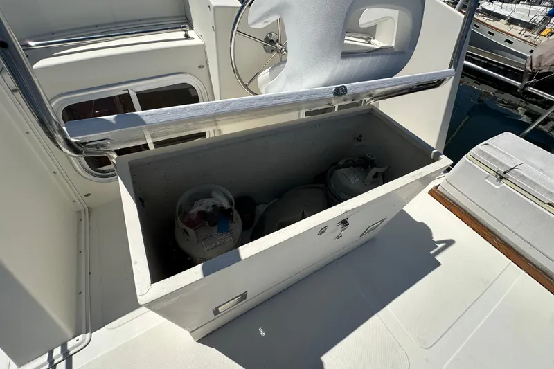 S.k.i Yacht Photos Pics Open storage compartment on 2000 Eagle 40 Pilothouse Trawler, containing propane tanks.