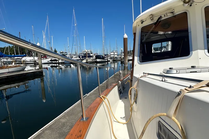 S.k.i Yacht Photos Pics 2000 Eagle 40 Pilothouse Trawler docked at marina, surrounded by sailboats.