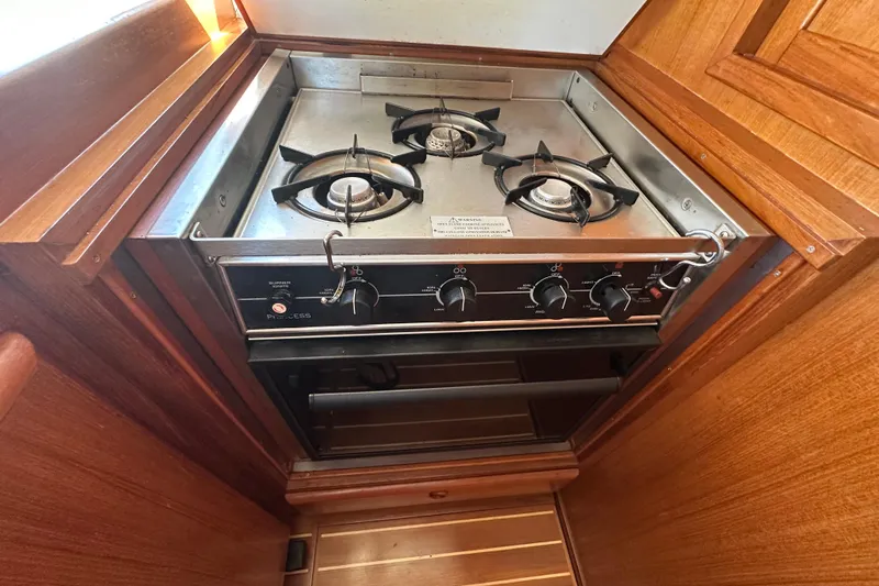 S.k.i Yacht Photos Pics Stainless steel stove with two burners in 2000 Eagle 40 Pilothouse Trawler kitchen.
