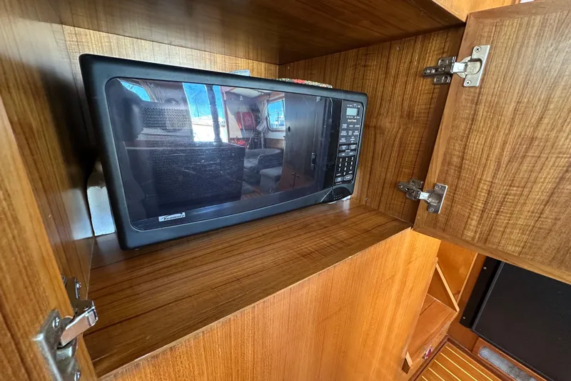 S.k.i Yacht Photos Pics Microwave in wooden cabinet on 2000 Eagle 40 Pilothouse Trawler.
