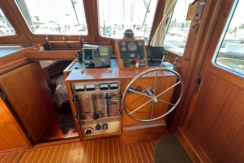 S.k.i Yacht Photos Pics Pilothouse of 2000 Eagle 40 Pilothouse Trawler with wooden interior and navigation equipment.
