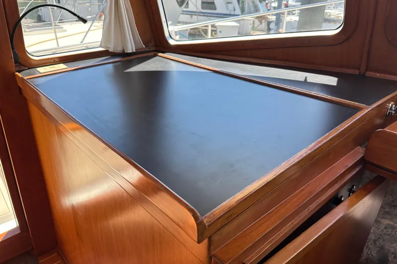 S.k.i Yacht Photos Pics Interior view of 2000 Eagle 40 Pilothouse Trawler's navigation desk area.