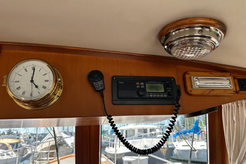 S.k.i Yacht Photos Pics Interior of 2000 Eagle 40 Pilothouse Trawler with clock, radio, and light fixture.