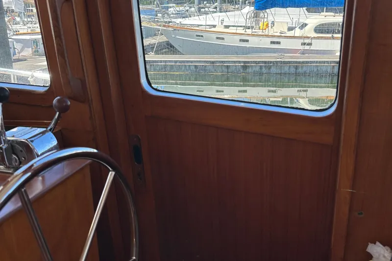 S.k.i Yacht Photos Pics Interior view of 2000 Eagle 40 Pilothouse Trawler with marina in background.