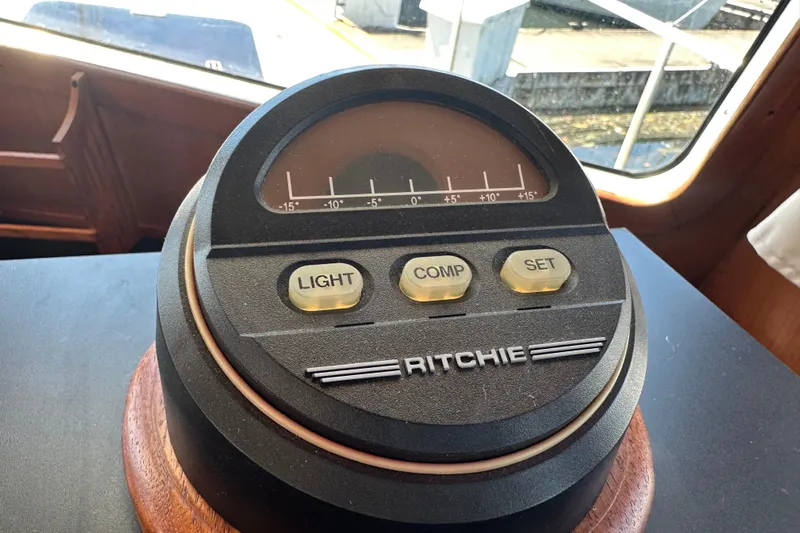 S.k.i Yacht Photos Pics Compass on 2000 Eagle 40 Pilothouse Trawler dashboard with light, comp, set buttons.