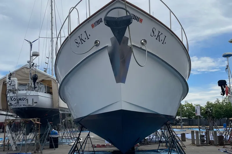S.k.i Yacht Photos Pics Eagle 40 Pilothouse Trawler 2000 in dry dock, front view with clear sky.