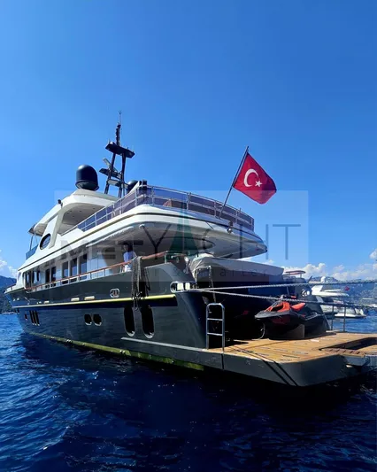  Yacht Photos Pics Luxury Ses Yachts 100, 2010 model, with Turkish flag, docked on serene blue waters.