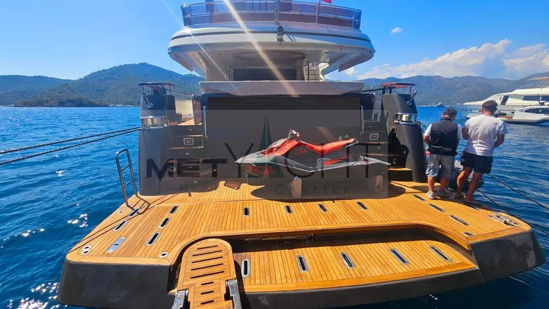  Yacht Photos Pics Luxury Ses Yachts 100, 2010 model, docked with scenic mountain backdrop.