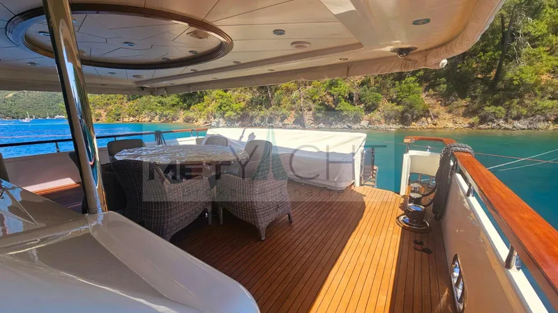  Yacht Photos Pics Luxurious Ses Yachts 100, 2010 model, featuring elegant deck with scenic waterfront view.