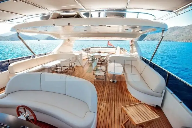  Yacht Photos Pics Luxurious 2010 Ses Yachts 100 with spacious deck, elegant seating, and stunning ocean view.