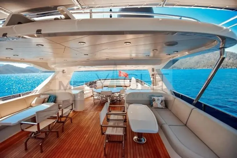  Yacht Photos Pics Luxurious 2010 Ses Yachts 100 with spacious deck, elegant seating, and stunning ocean view.