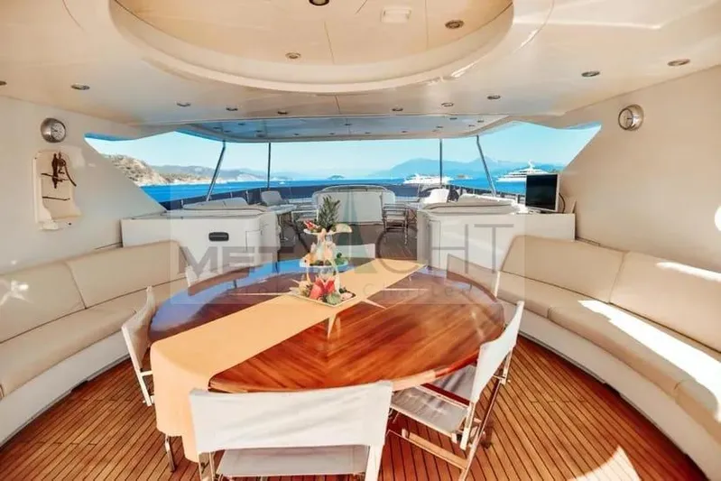  Yacht Photos Pics Luxurious Ses Yachts 100, 2010 model, featuring elegant outdoor dining area with ocean view.