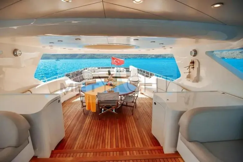  Yacht Photos Pics Luxurious 2010 Ses Yachts 100 deck with elegant seating and ocean view.