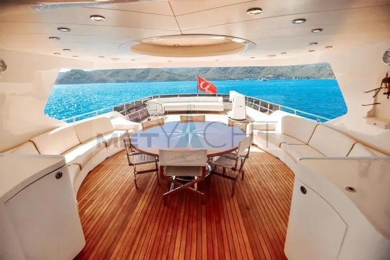  Yacht Photos Pics Luxurious Ses Yachts 100, 2010 model, featuring elegant deck with seating and ocean view.