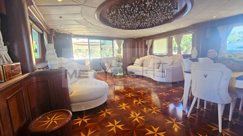  Yacht Photos Pics Luxurious interior of 2010 Ses Yachts 100 with elegant seating and intricate wood flooring.