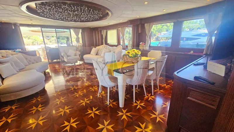  Yacht Photos Pics Luxurious interior of 2010 Ses Yachts 100 with elegant dining area and star-patterned flooring.