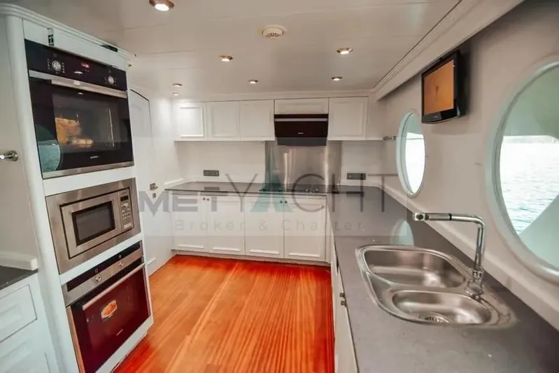  Yacht Photos Pics Luxurious kitchen interior of 2010 Ses Yachts 100, featuring modern appliances and sleek design.