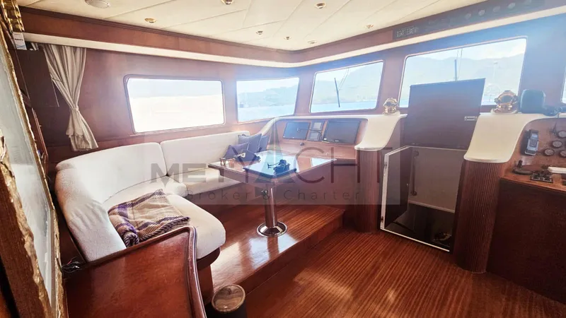  Yacht Photos Pics Luxurious interior of 2010 Ses Yachts 100 with elegant wood finish and panoramic windows.