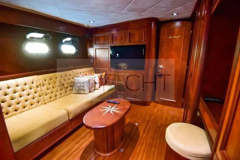  Yacht Photos Pics Luxurious interior of 2010 Ses Yachts 100 with plush seating and elegant wood finishes.