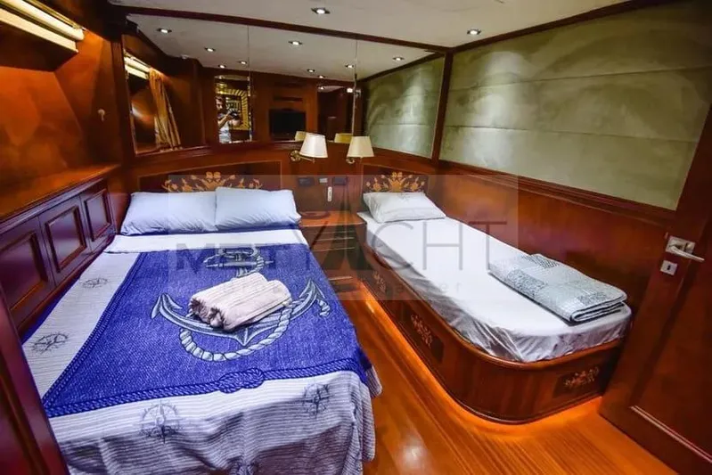  Yacht Photos Pics Luxurious cabin interior of 2010 Ses Yachts 100 with twin beds and elegant wood finish.
