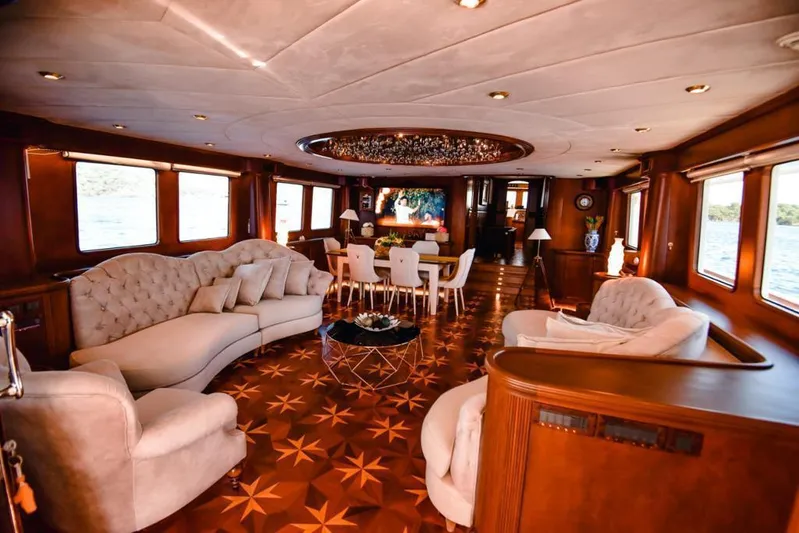 Yacht Photos Pics Luxurious interior of 2010 Ses Yachts 100, featuring elegant seating and dining area.