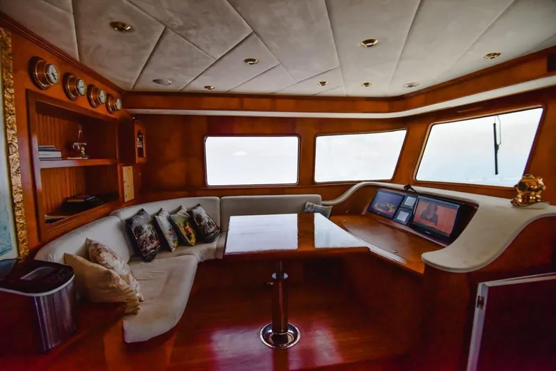  Yacht Photos Pics Luxurious interior of 2010 Ses Yachts 100 with plush seating and navigation screens.