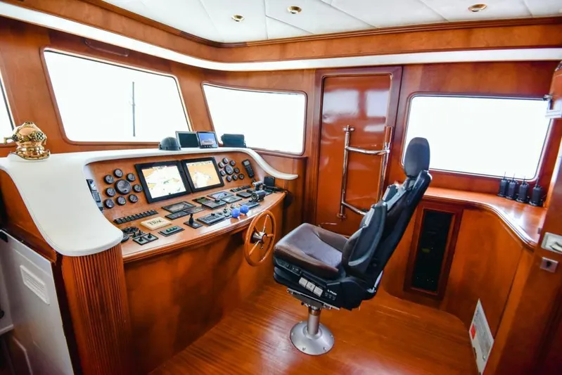  Yacht Photos Pics Luxurious 2010 Ses Yachts 100 helm with advanced navigation controls and plush captain's chair.