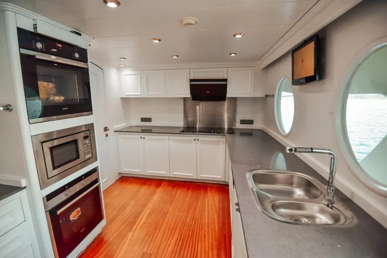  Yacht Photos Pics Luxurious kitchen interior of 2010 Ses Yachts 100, featuring modern appliances and sleek design.
