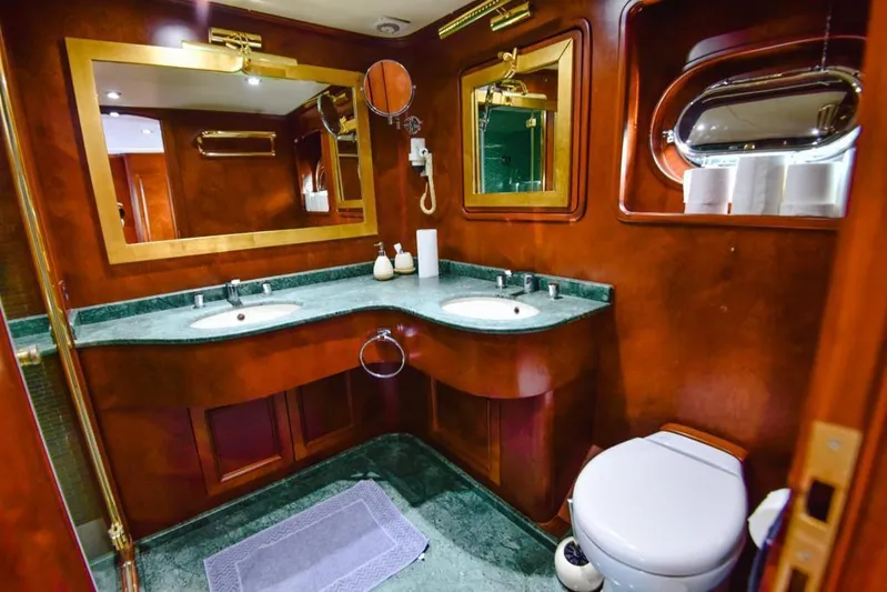  Yacht Photos Pics Luxurious bathroom on 2010 Ses Yachts 100, featuring elegant wood and marble finishes.