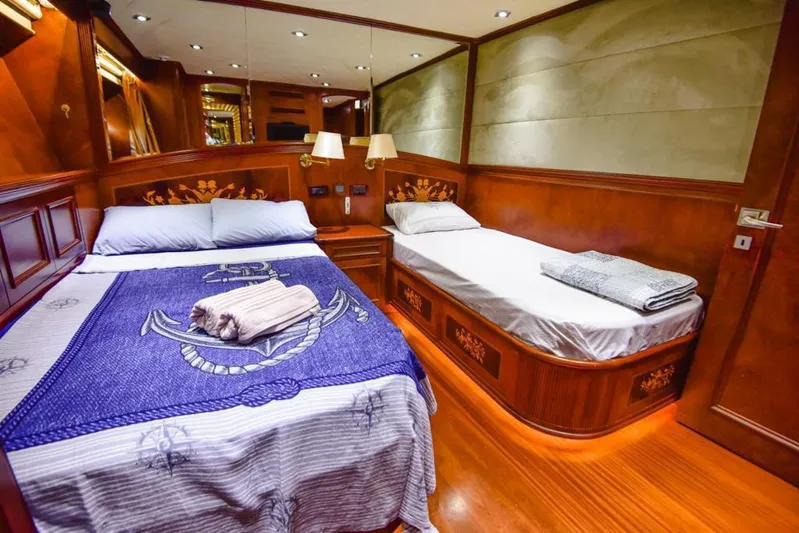  Yacht Photos Pics Luxurious cabin interior of 2010 Ses Yachts 100 with wooden decor and twin beds.