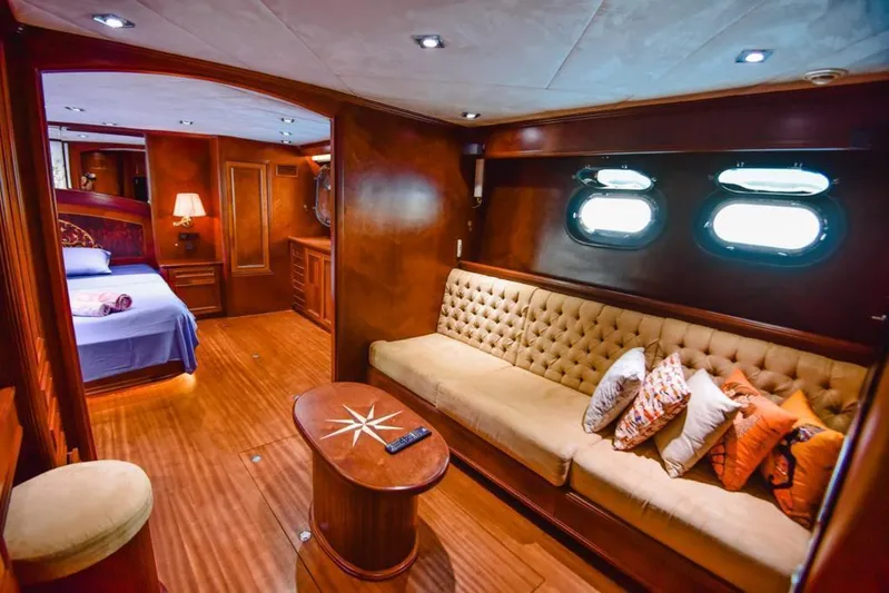  Yacht Photos Pics Luxurious interior of 2010 Ses Yachts 100, featuring elegant wood finishes and plush seating.