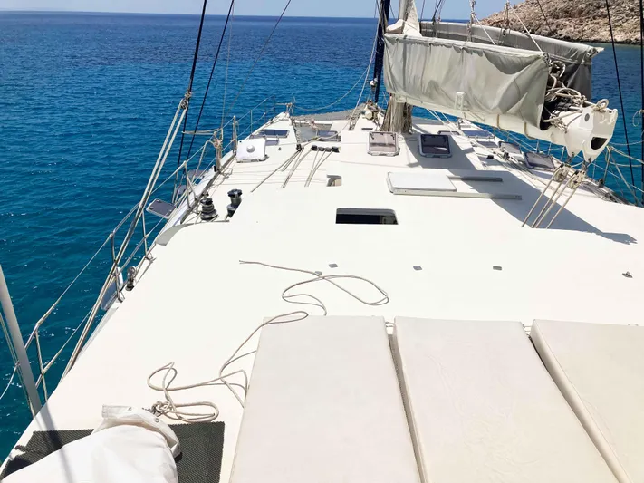 Conan Yacht Photos Pics 1988 Joubert Custom Trimaran on clear blue water.