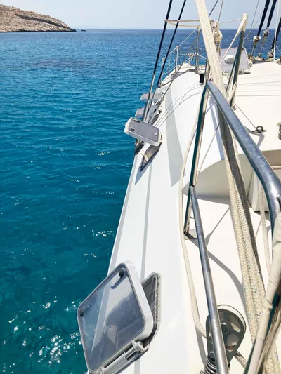 Conan Yacht Photos Pics 1988 Joubert Custom Trimaran sailing on clear blue waters.