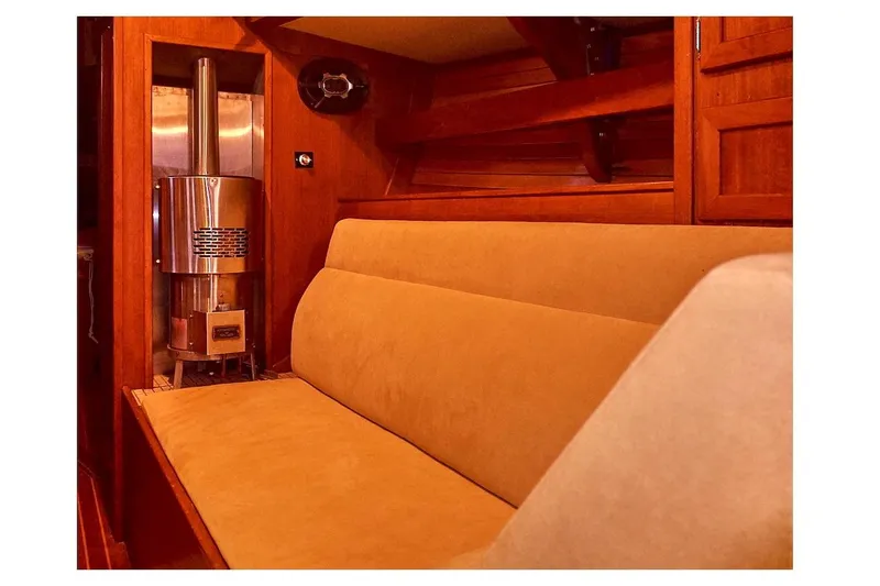  Yacht Photos Pics Interior of 1983 Valiant 40 Selah yacht with cozy seating and wood paneling.