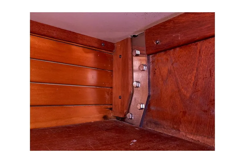  Yacht Photos Pics Interior woodwork of 1983 Valiant 40 Selah boat, showcasing bolts and paneling.