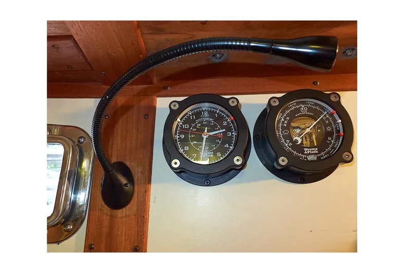  Yacht Photos Pics Valiant 40 Selah 1983 boat gauges and lamp on wooden panel.