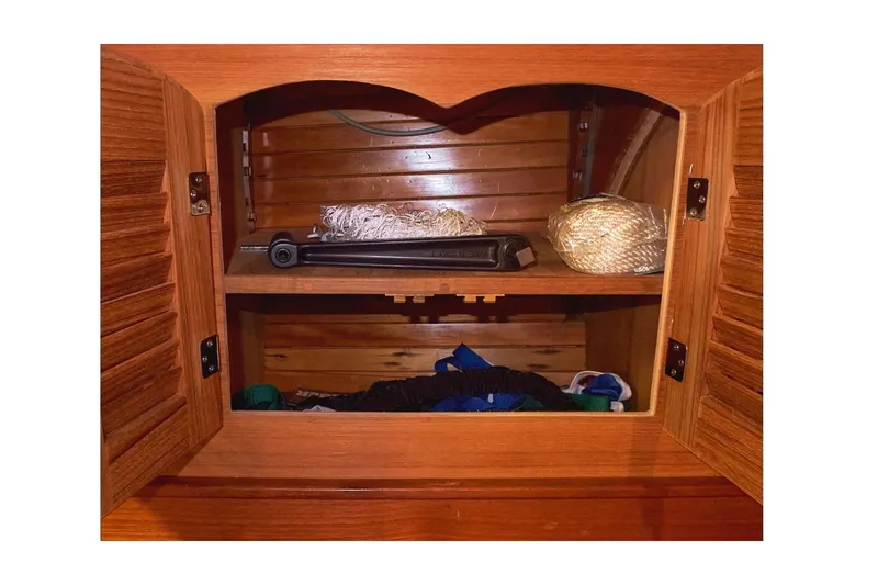  Yacht Photos Pics Wooden cabinet interior with rope and items, Valiant 40 Selah, 1983 model.