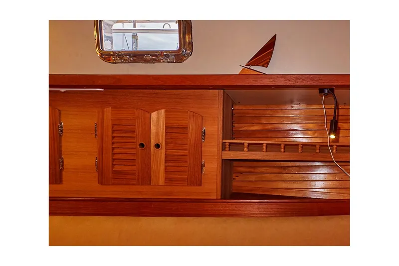  Yacht Photos Pics Interior of 1983 Valiant 40 Selah yacht with wooden cabinets and nautical decor.