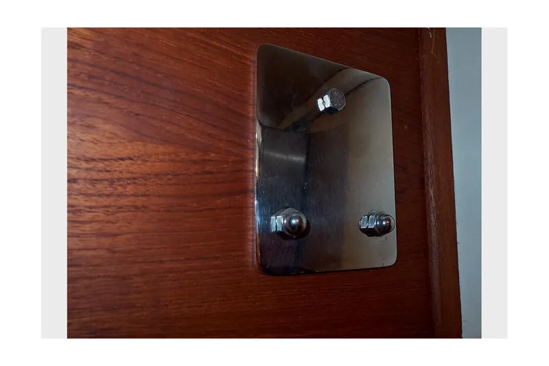  Yacht Photos Pics Metal plate with bolts on wooden surface, Valiant 40 Selah, 1983.