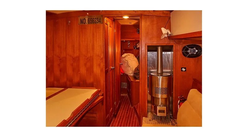 Yacht Photos Pics Interior of 1983 Valiant 40 Selah yacht with wooden paneling and cozy cabin space.
