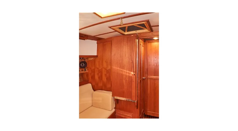  Yacht Photos Pics Interior of 1983 Valiant 40 Selah yacht with wooden paneling and seating.