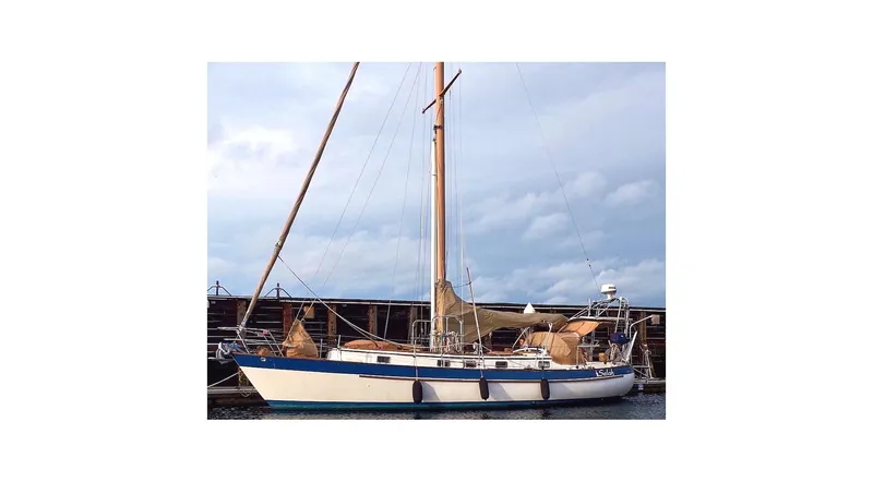  Yacht Photos Pics 1983 Valiant 40 Selah sailboat docked under cloudy sky.