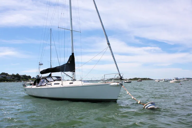 Lola Yacht Photos Pics Sailboat J/130 by J Boats, 1995 model, anchored in a scenic bay.