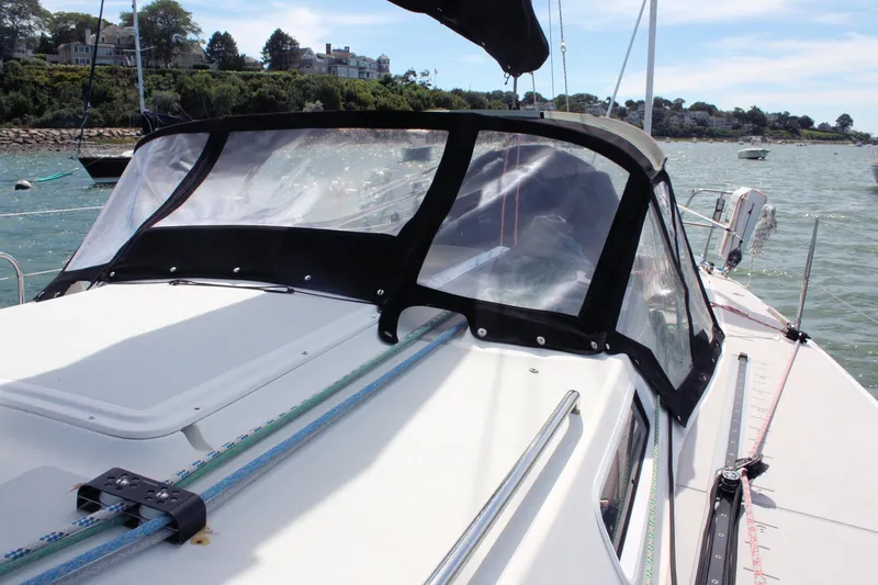 Lola Yacht Photos Pics 1995 J Boats J/130 sailboat with cockpit cover on a sunny day.