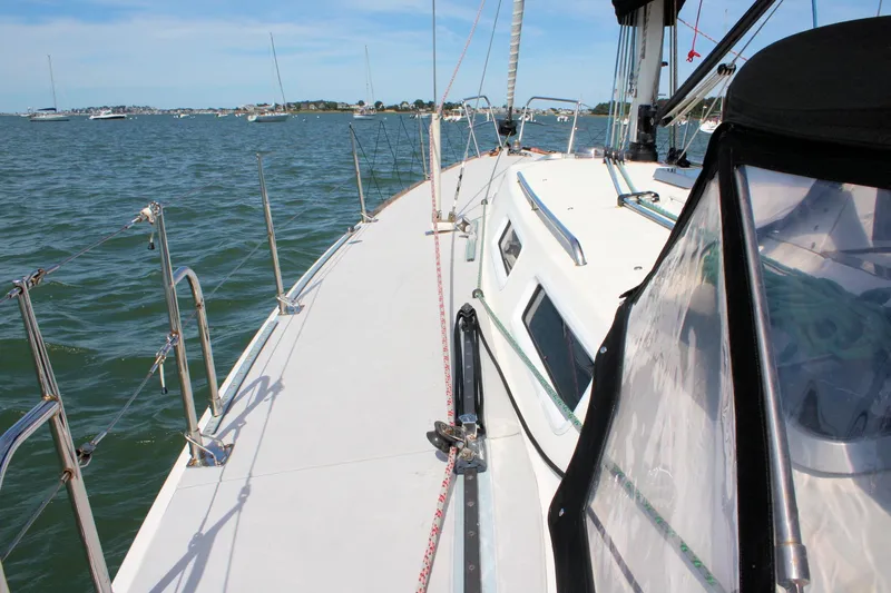 Lola Yacht Photos Pics Sailing on a 1995 J Boats J/130 yacht, view of deck and ocean.